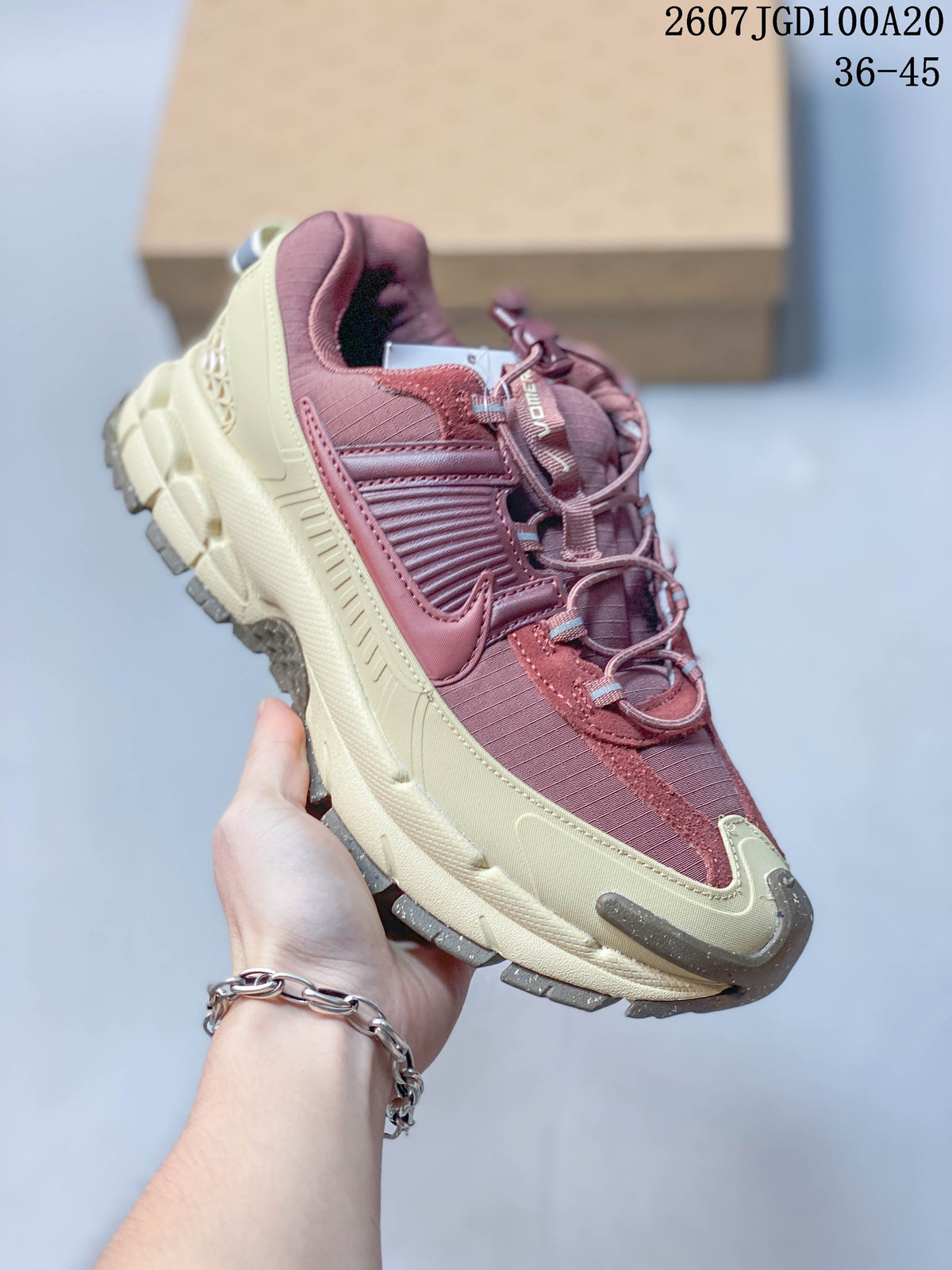 Nike Zoom Vomero Roam Sneakers in Burgundy Cream 2607TGD100A20 - product image from the listing.