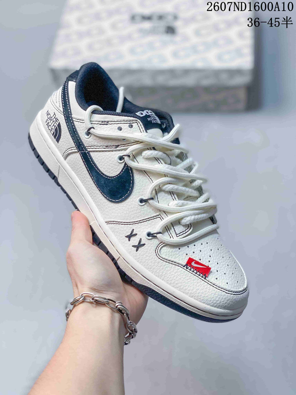 Nike SB Dunk Low Sneakers in White Navy 2607ND1600A10 - product image from the listing.