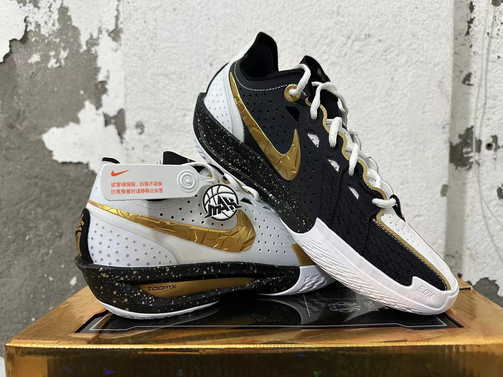 Nike GT Cut 3 Basketball Shoes in White Black Gold - product image from the listing.
