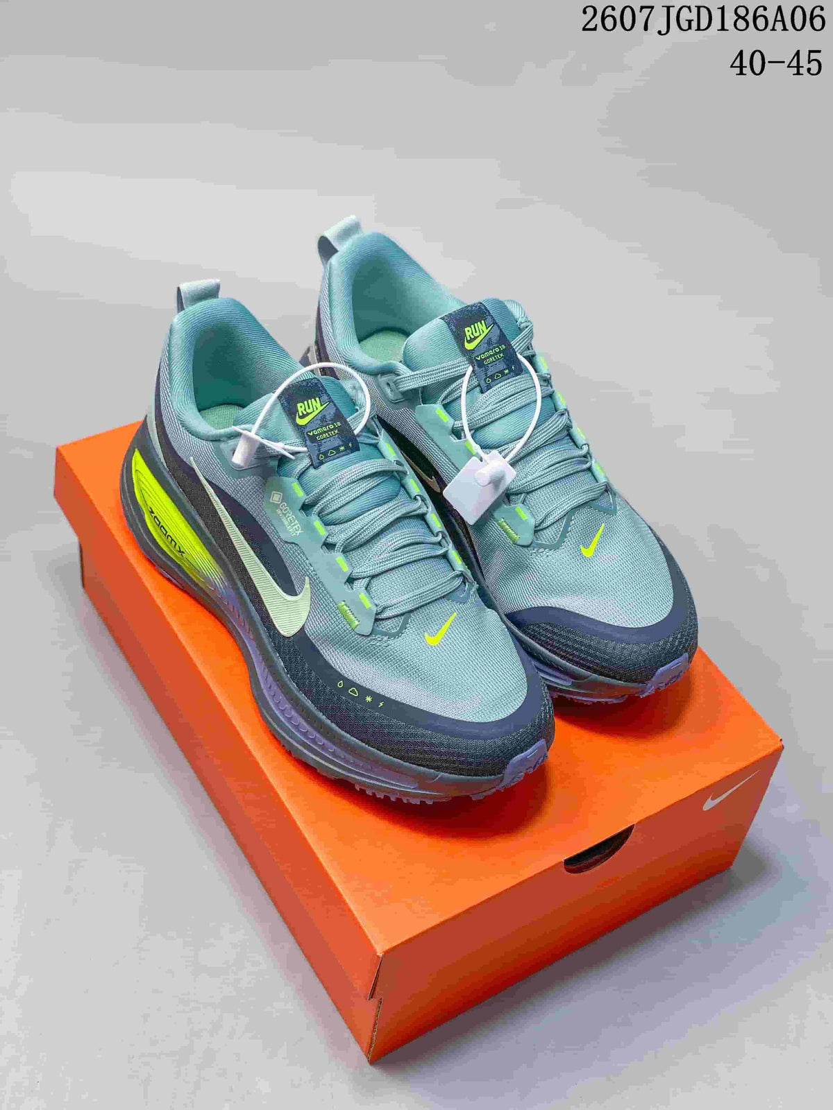 Nike Vomero Plus Run Running Sneakers in Gray - product image from the listing.