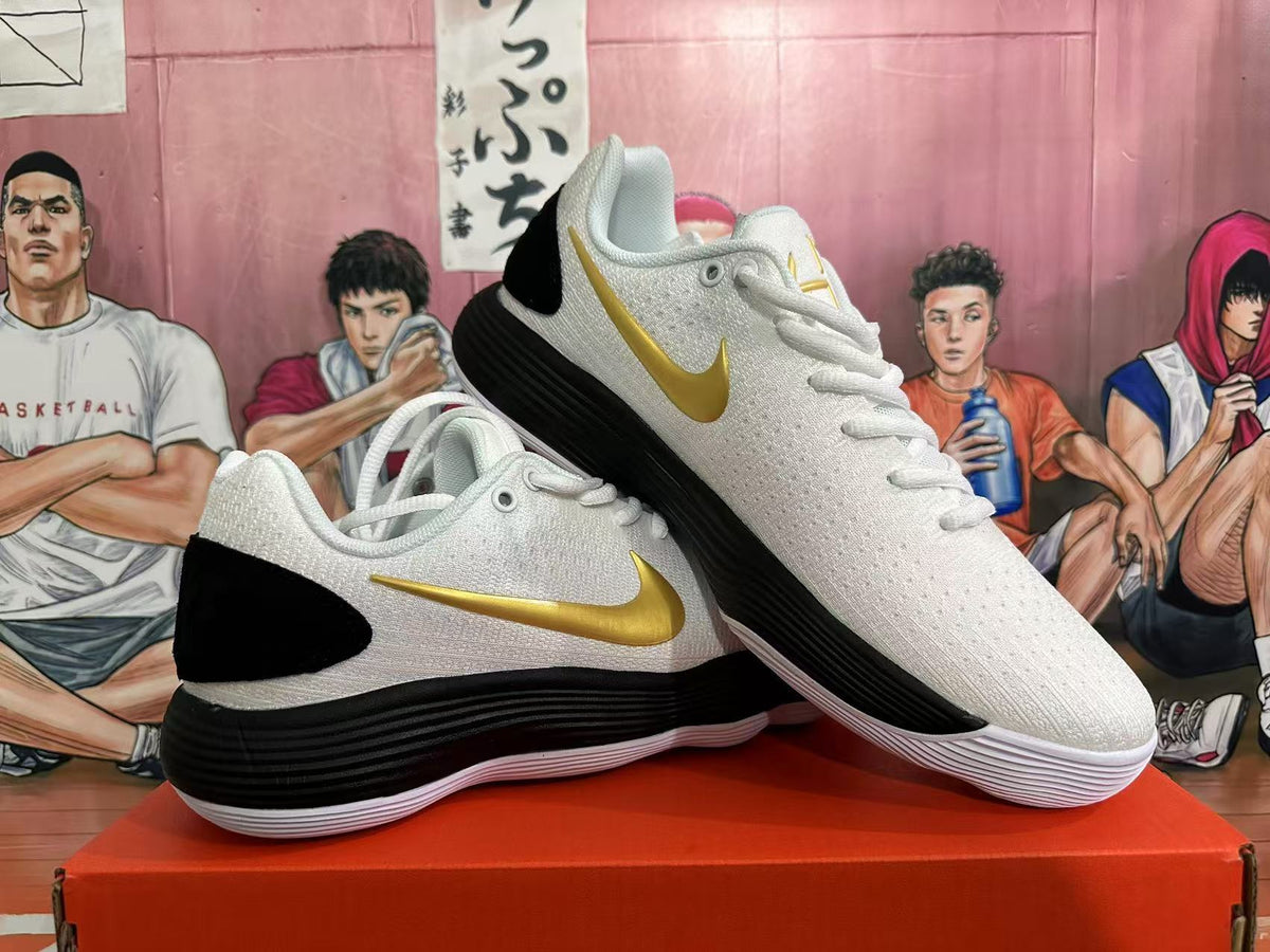 Nike Basketball Shoes in White Black Gold - product image from the listing.