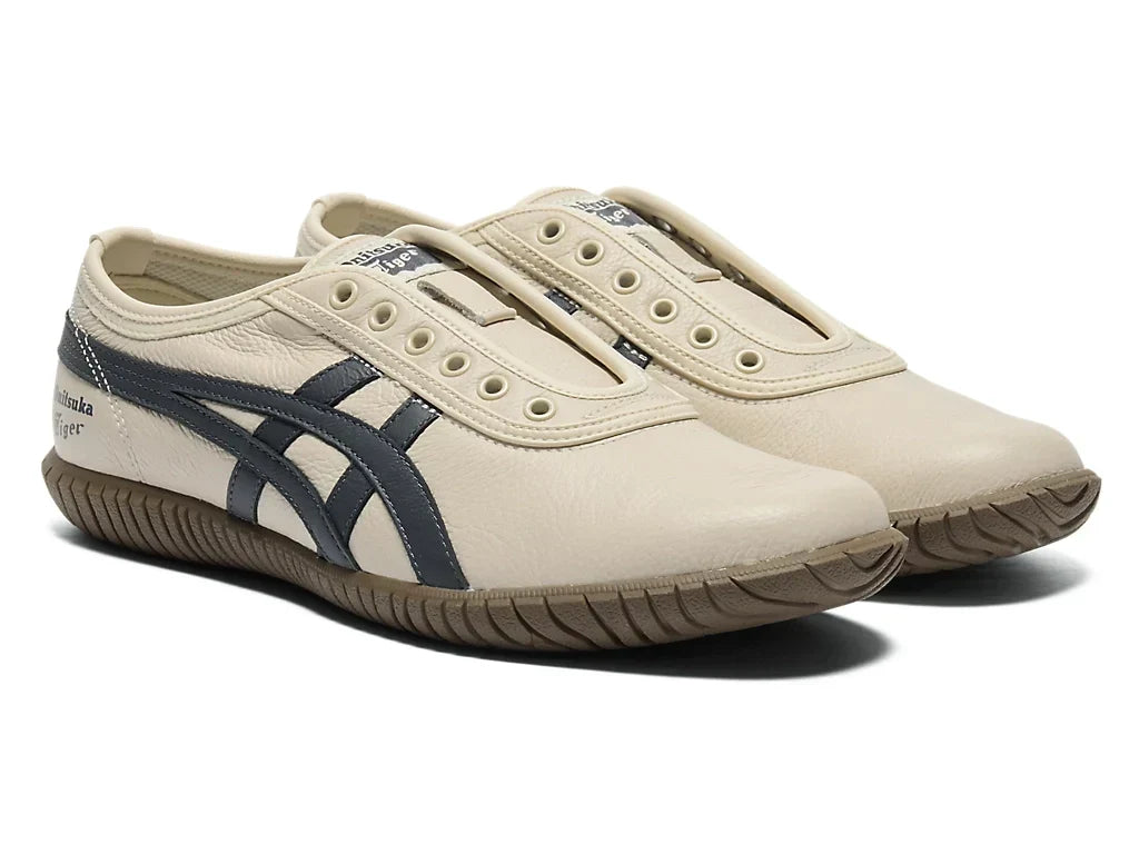 Birch Indigo Navy | 1183C529 200 - Onitsuka Tiger Tsunahiki Slip-On Sneakers - product image from the listing.
