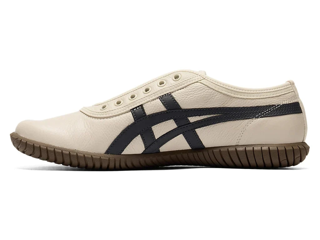 Birch Indigo Navy | 1183C529 200 - Onitsuka Tiger Tsunahiki Slip-On Sneakers - product image from the listing.