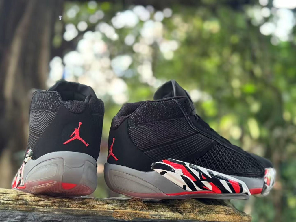 Jordan XXXVIII Playoffs 23 Basketball Shoes in Black Red - product image from the listing.