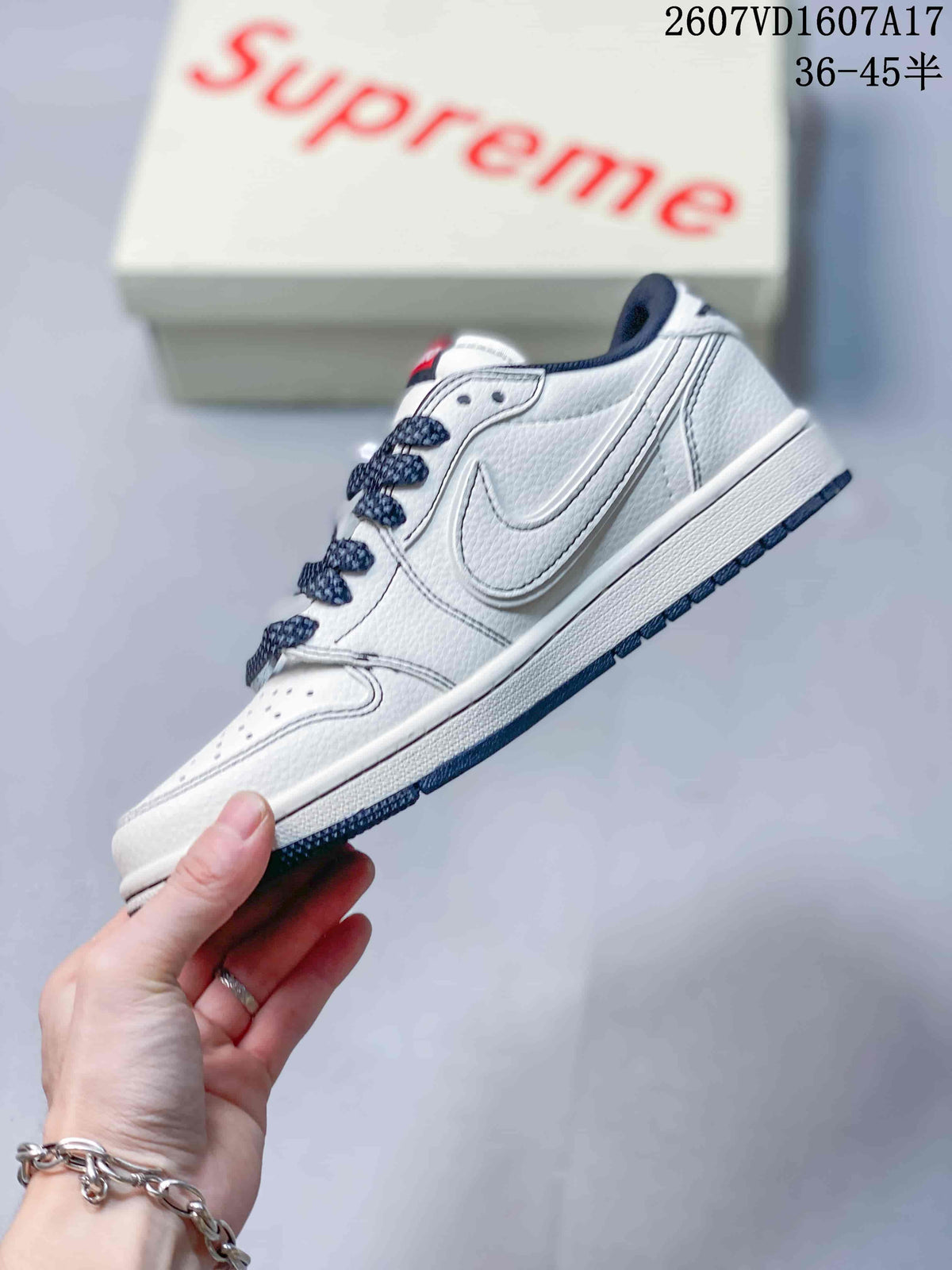 Jordan 1 Low Sneakers in White and Navy - product image from the listing.