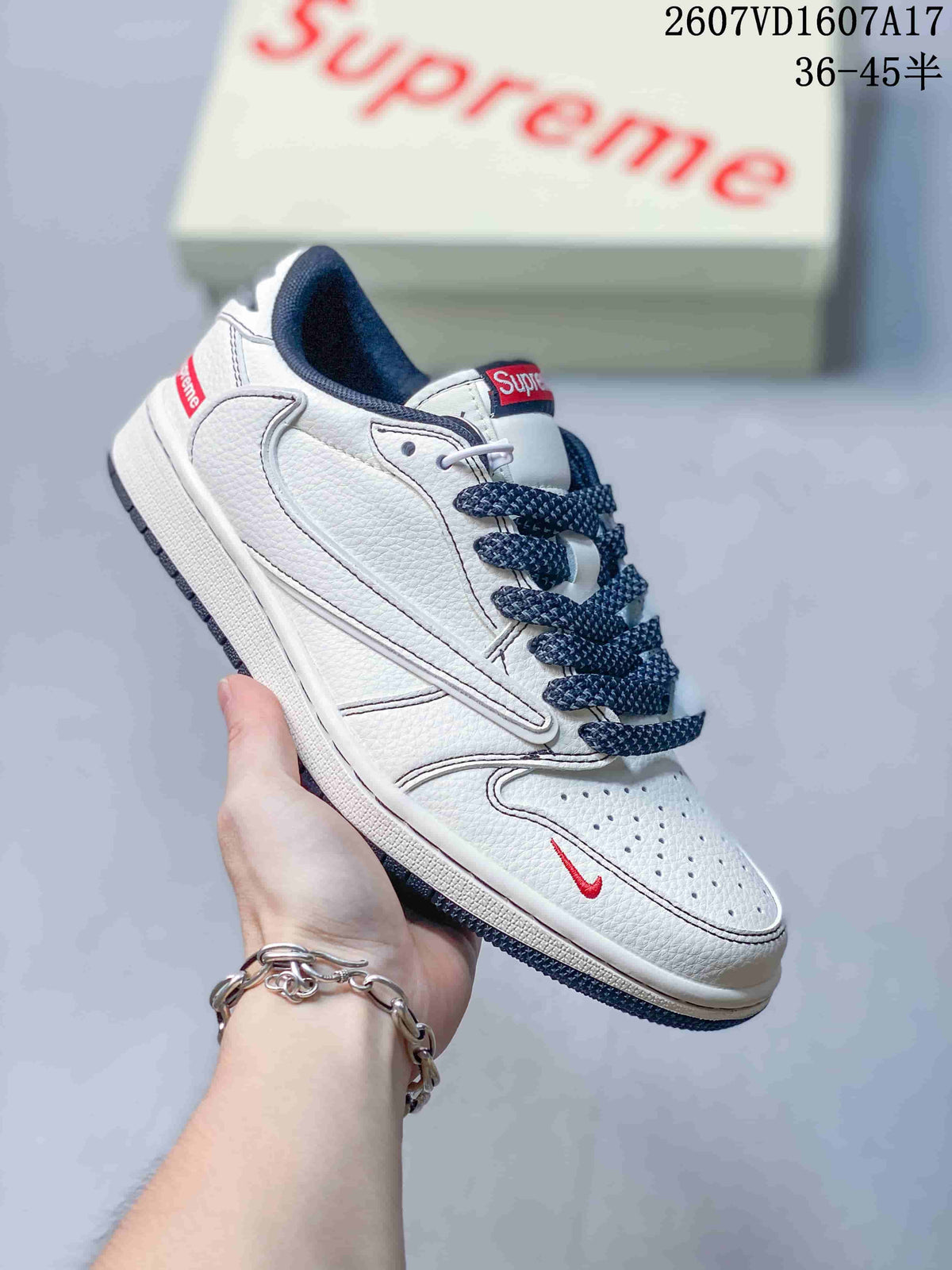 Jordan 1 Low Sneakers in White and Navy - product image from the listing.