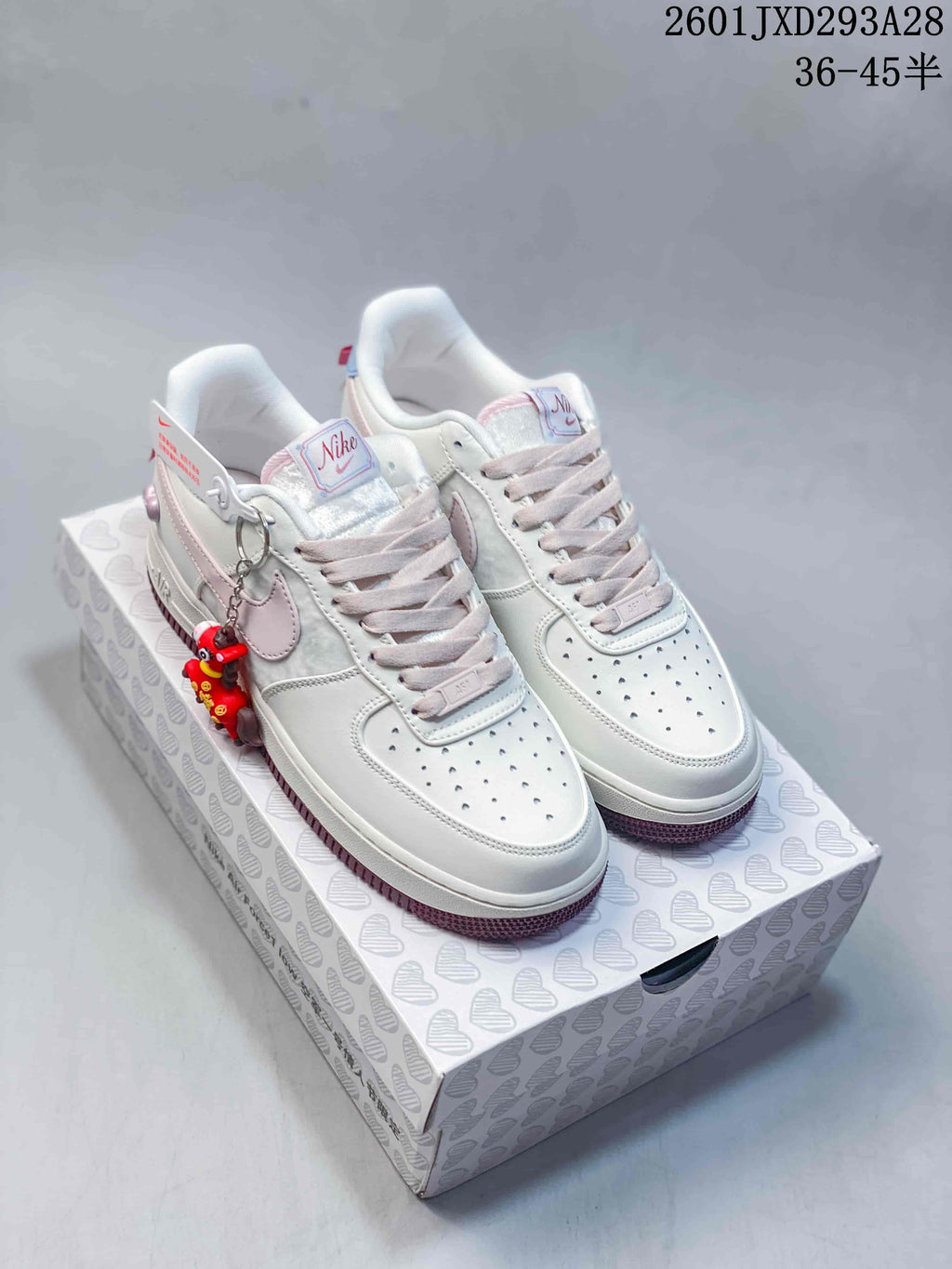 Nike Air Force 1 '07 Low Sneakers in White and Pink 2601JXD293A28 - product image from the listing.