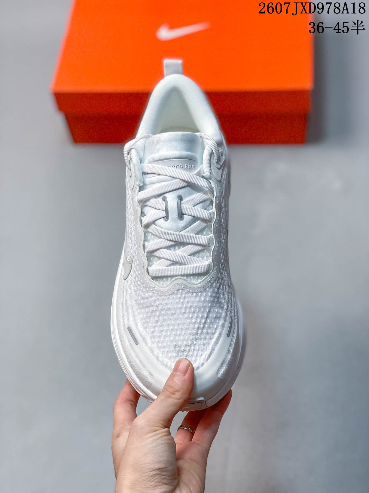 Nike Vomero Plus Running Shoes in White JXD978A18 - product image from the listing.