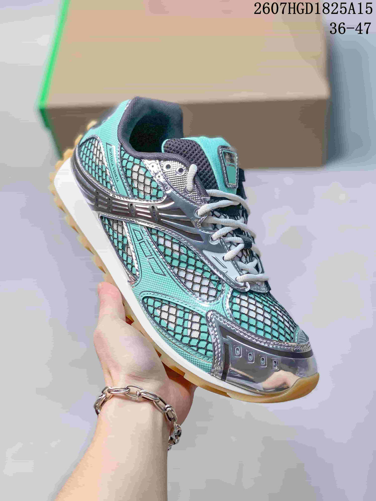 Bottega Veneta Orbit Runner Sneakers in Aqua Silver 2607HGD1825A15 - product image from the listing.