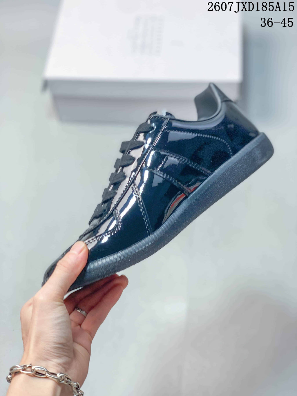 Maison Margiela S57WS0236 Glossy Low-Cut Sneakers - product image from the listing.