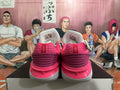 Magenta and White Nike Basketball Shoes - product image from the listing.
