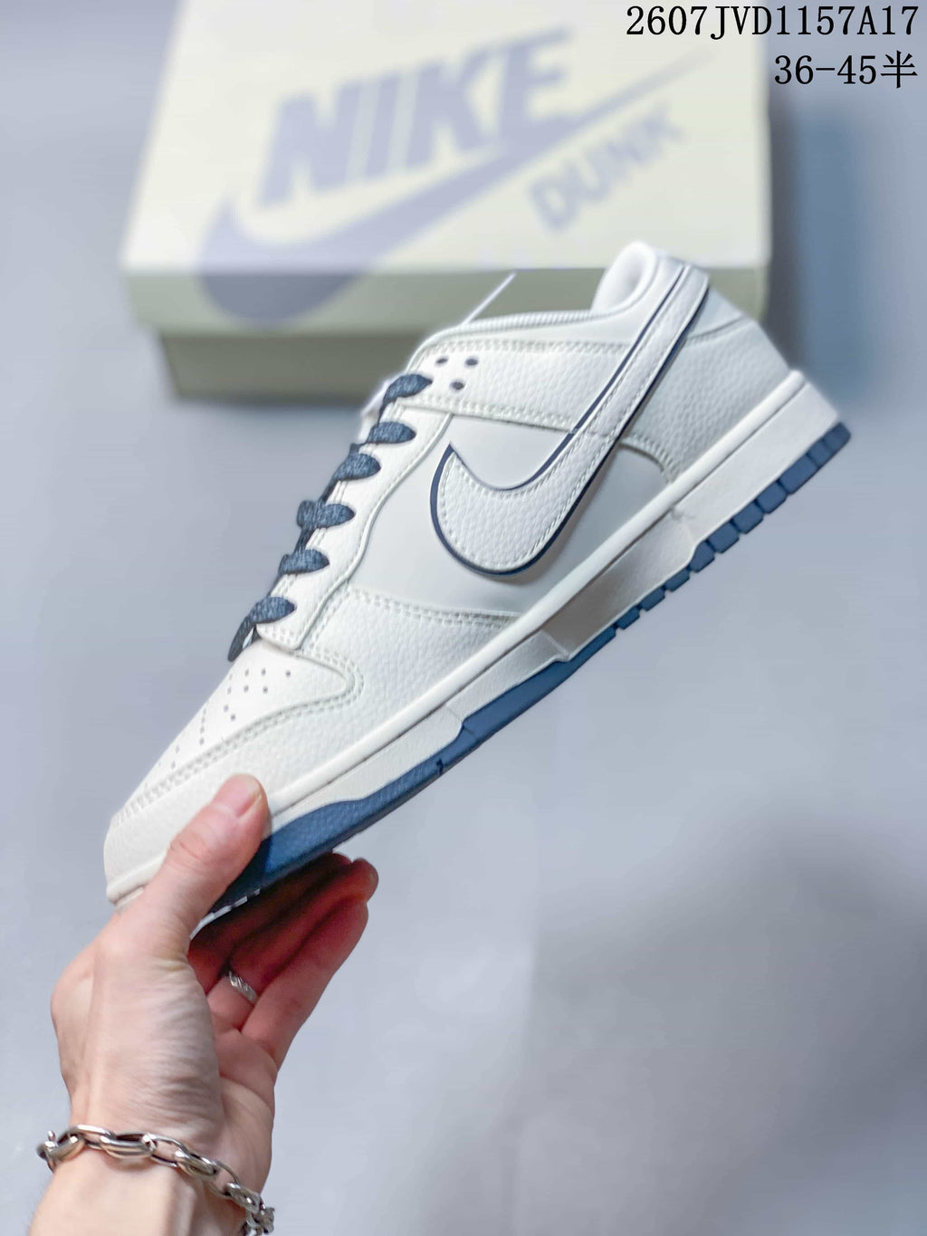 Louis Vuitton x Nike Dunk Low Sneakers in White Blue - product image from the listing.