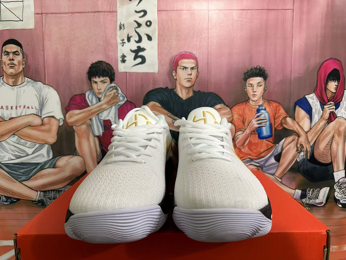 Nike Basketball Shoes in White Black Gold - product image from the listing.