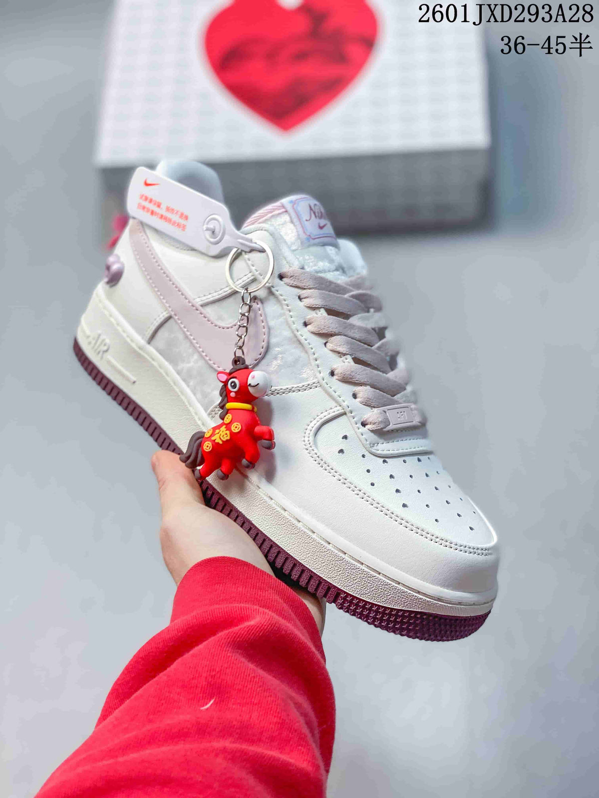 Nike Air Force 1 '07 Low Sneakers in White and Pink 2601JXD293A28 - product image from the listing.