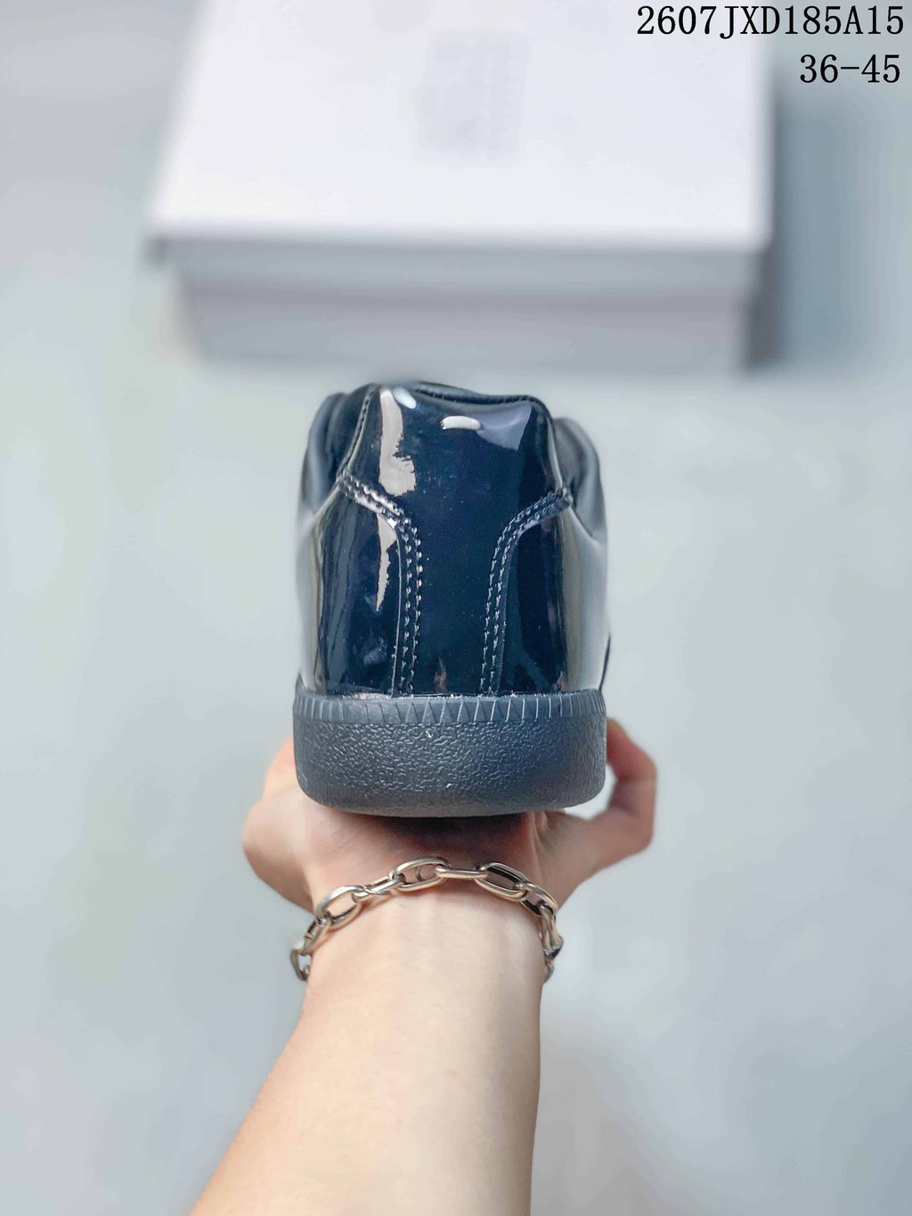 Maison Margiela S57WS0236 Glossy Low-Cut Sneakers - product image from the listing.
