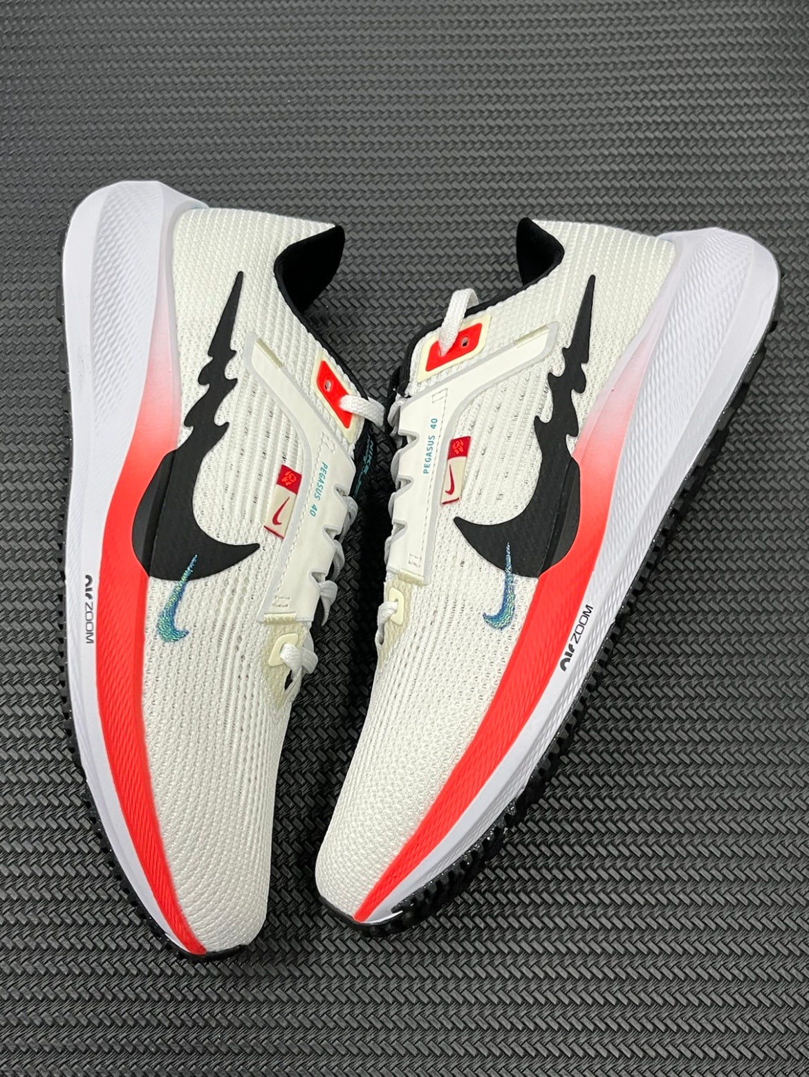 Nike Air Zoom Pegasus 40 Running Shoes in White Multicolor FZ5055-101 - product image from the listing.