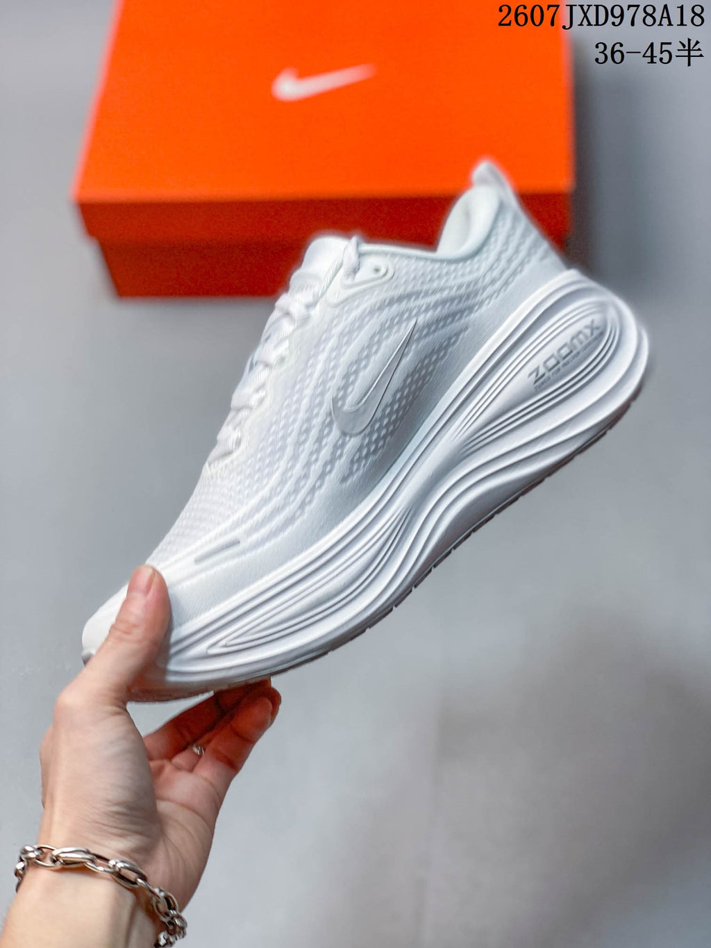 Nike Vomero Plus Running Shoes in White JXD978A18 - product image from the listing.