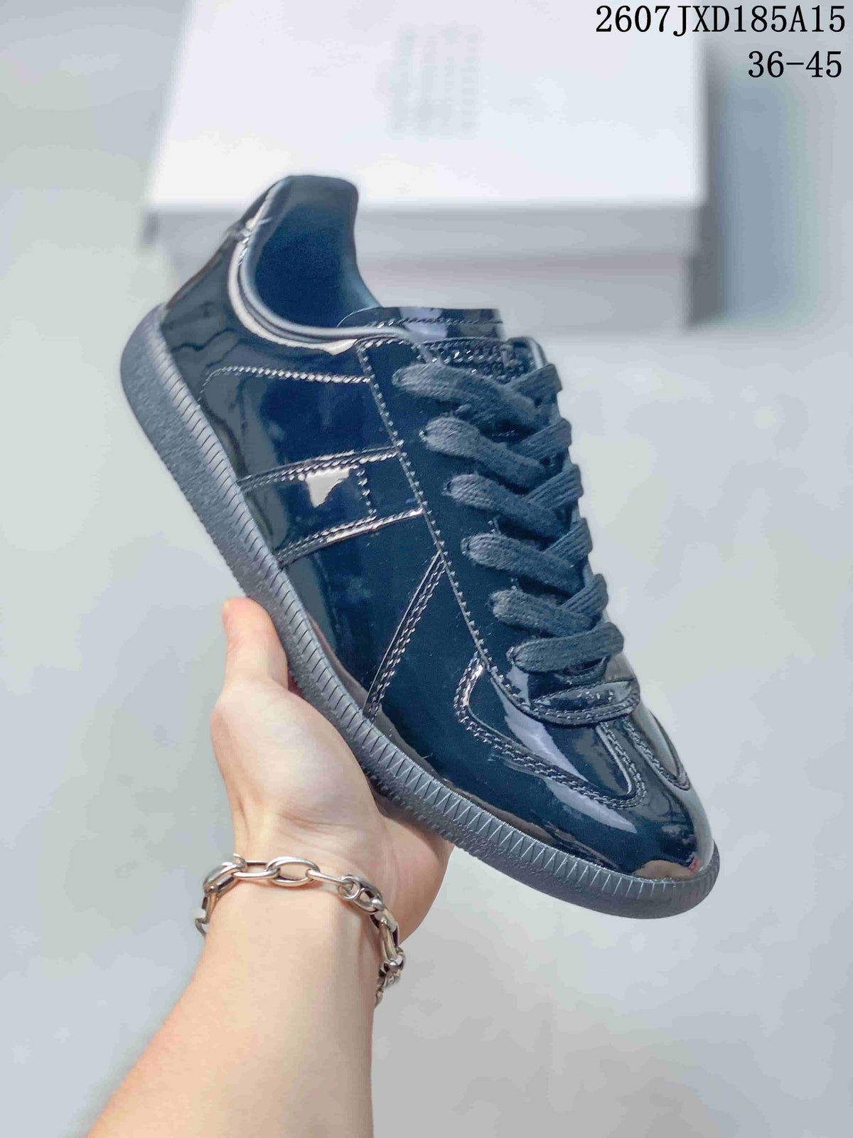 Maison Margiela S57WS0236 Glossy Low-Cut Sneakers - product image from the listing.