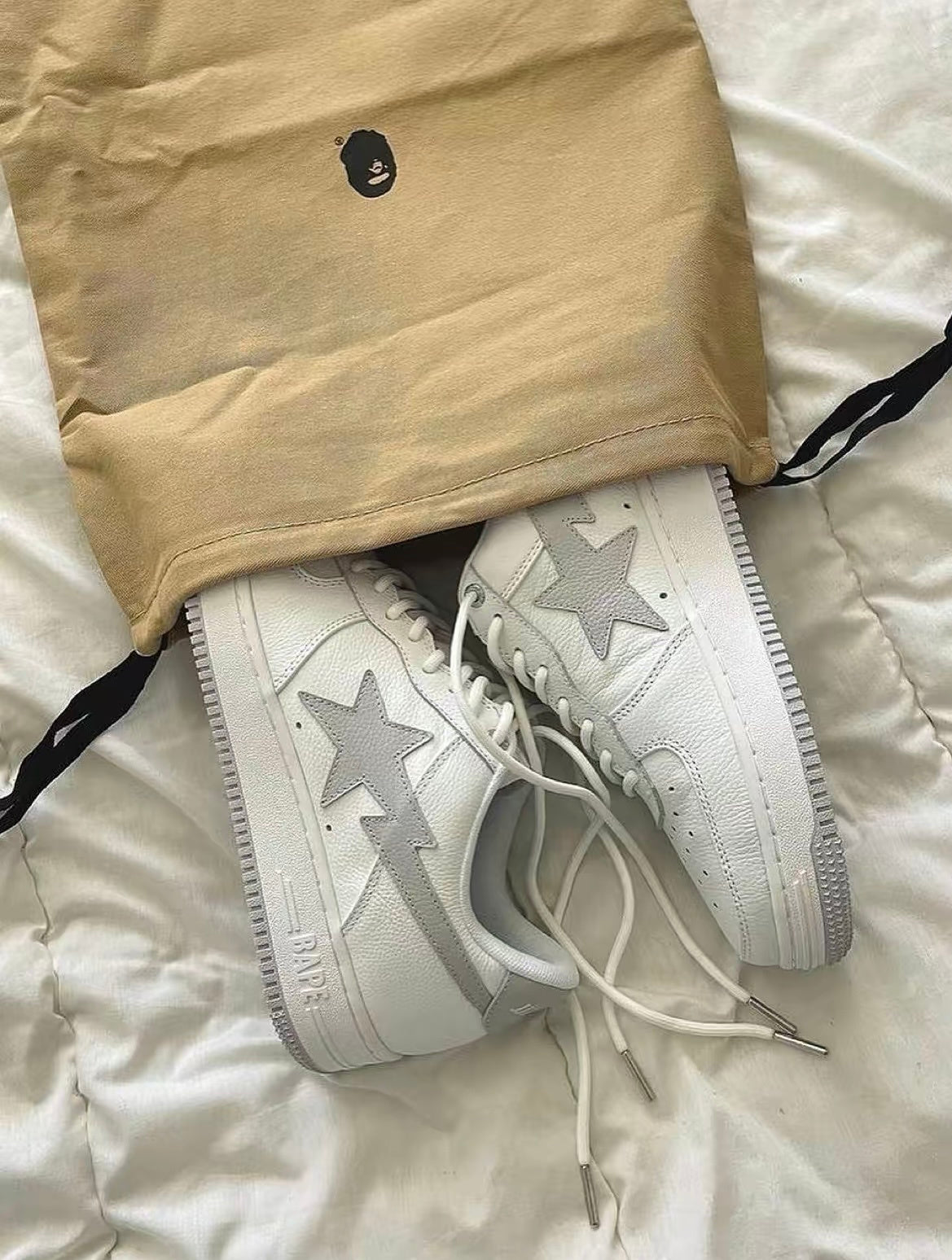 White and Grey BAPE STA Low Sneakers - product image from the listing.
