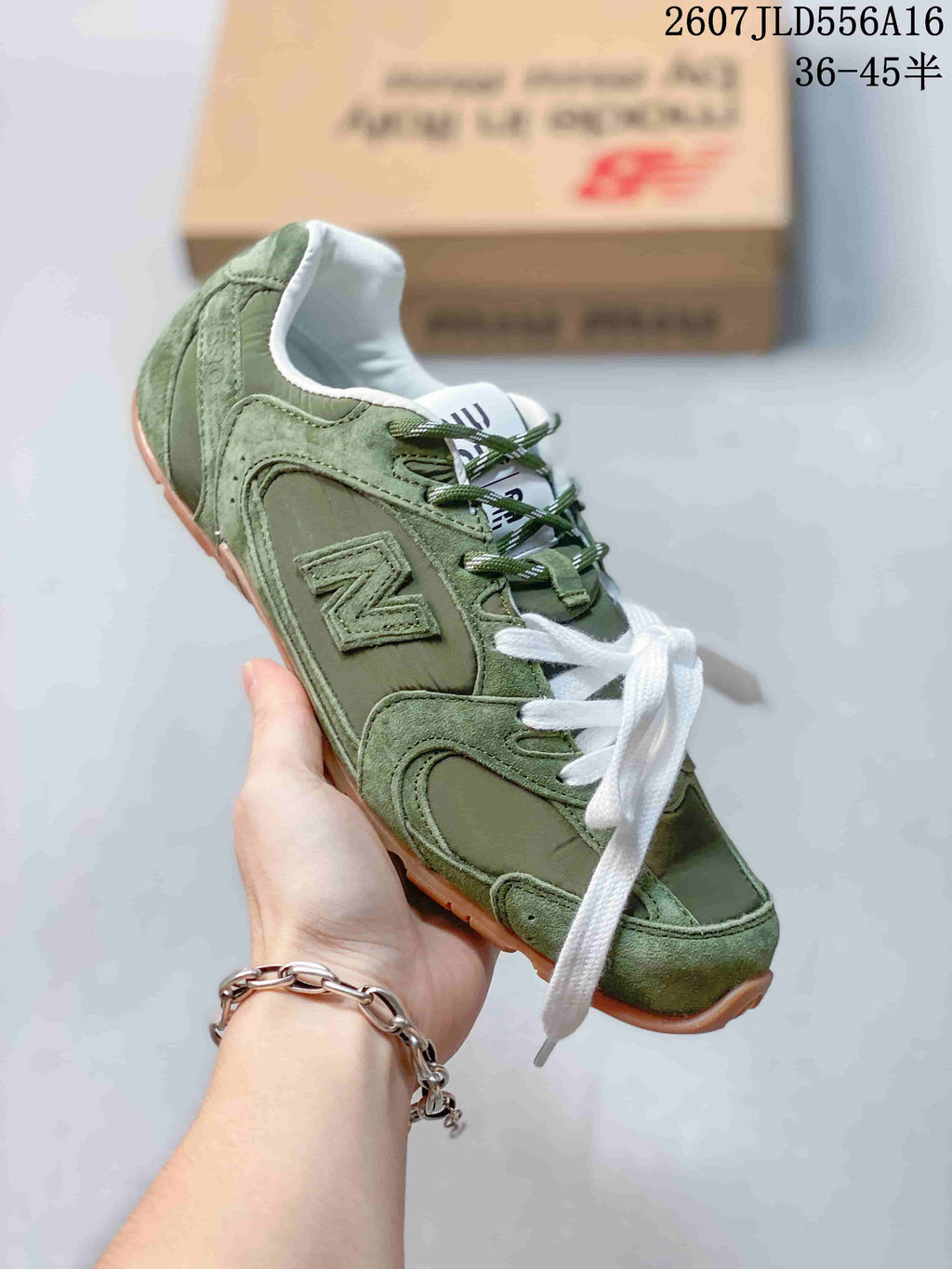 Miu Miu x New Balance 530 SL Sneakers in Green 2607JLD556A16 - product image from the listing.
