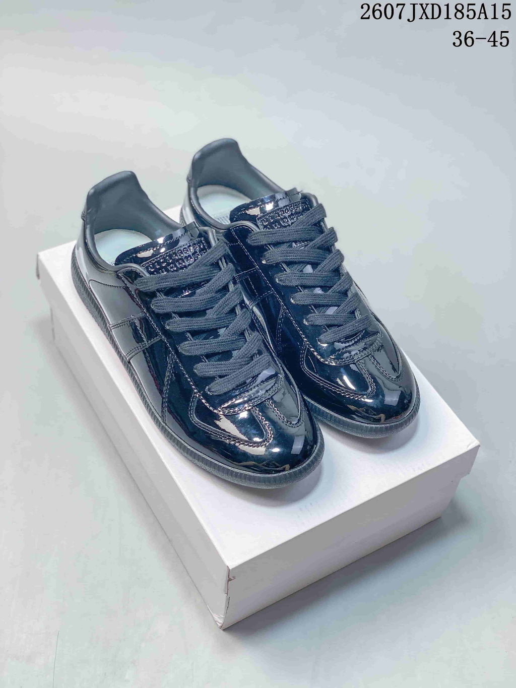 Maison Margiela S57WS0236 Glossy Low-Cut Sneakers - product image from the listing.