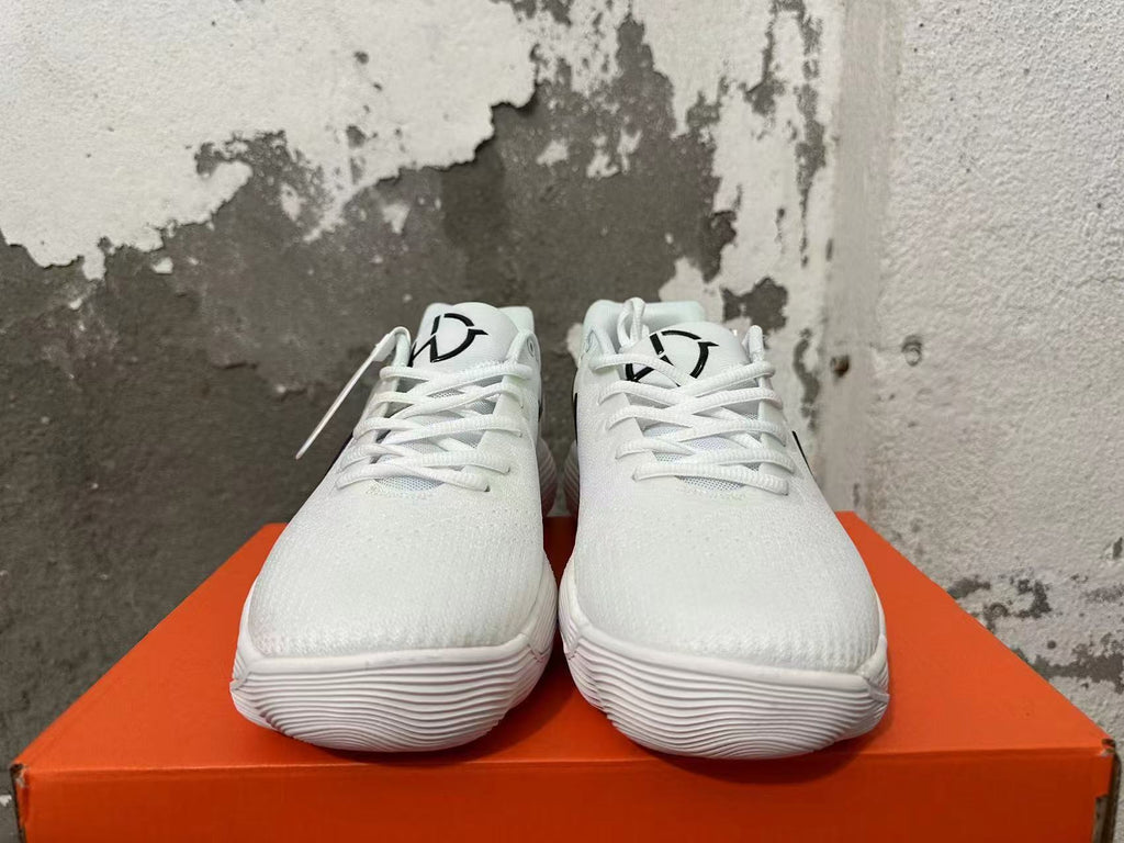 Nike White Basketball Footwear with Black Swoosh - product image from the listing.