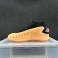 High-Top Sneakers in Black and Orange - product image from the listing.
