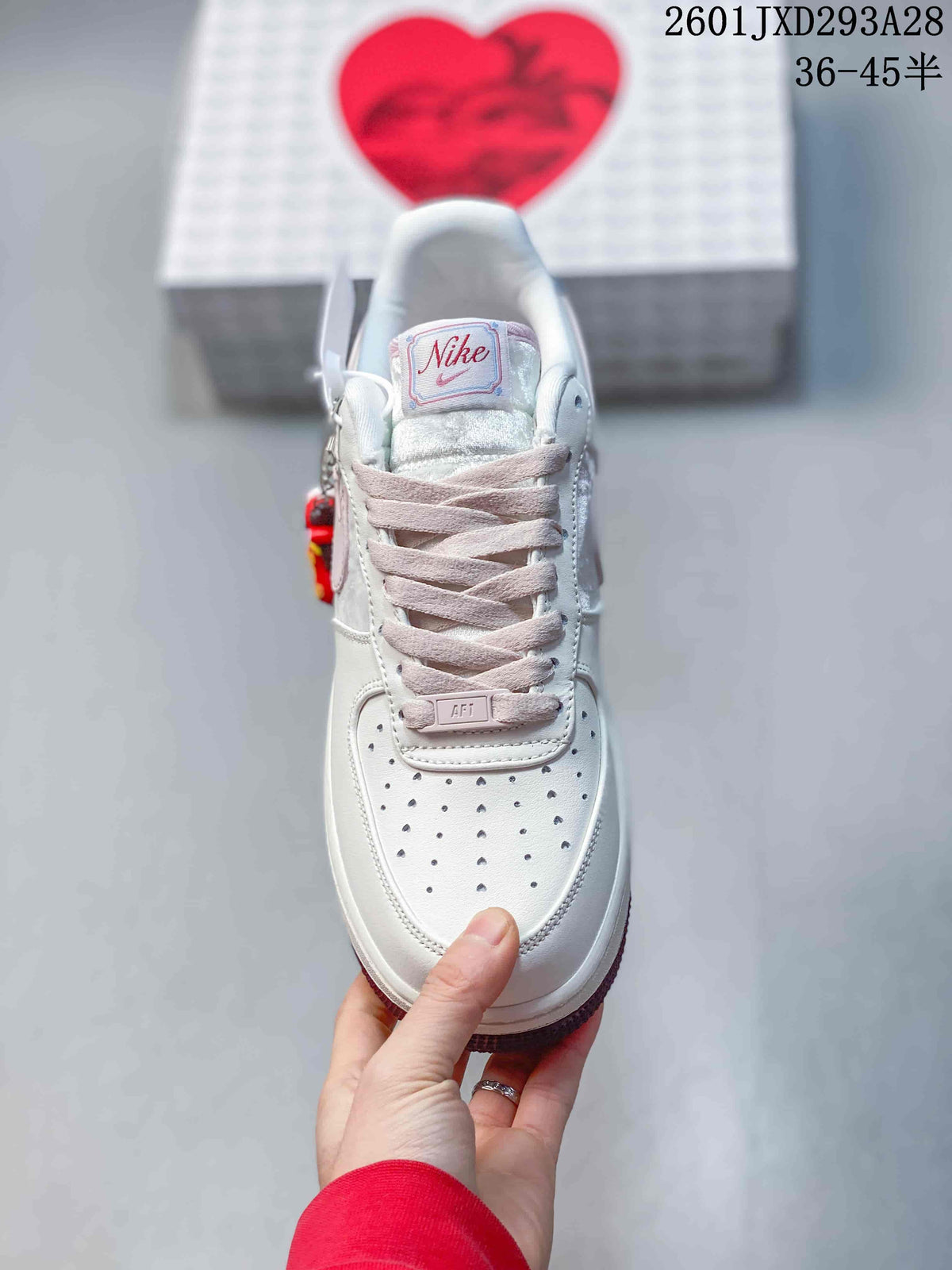 Nike Air Force 1 '07 Low Sneakers in White and Pink 2601JXD293A28 - product image from the listing.