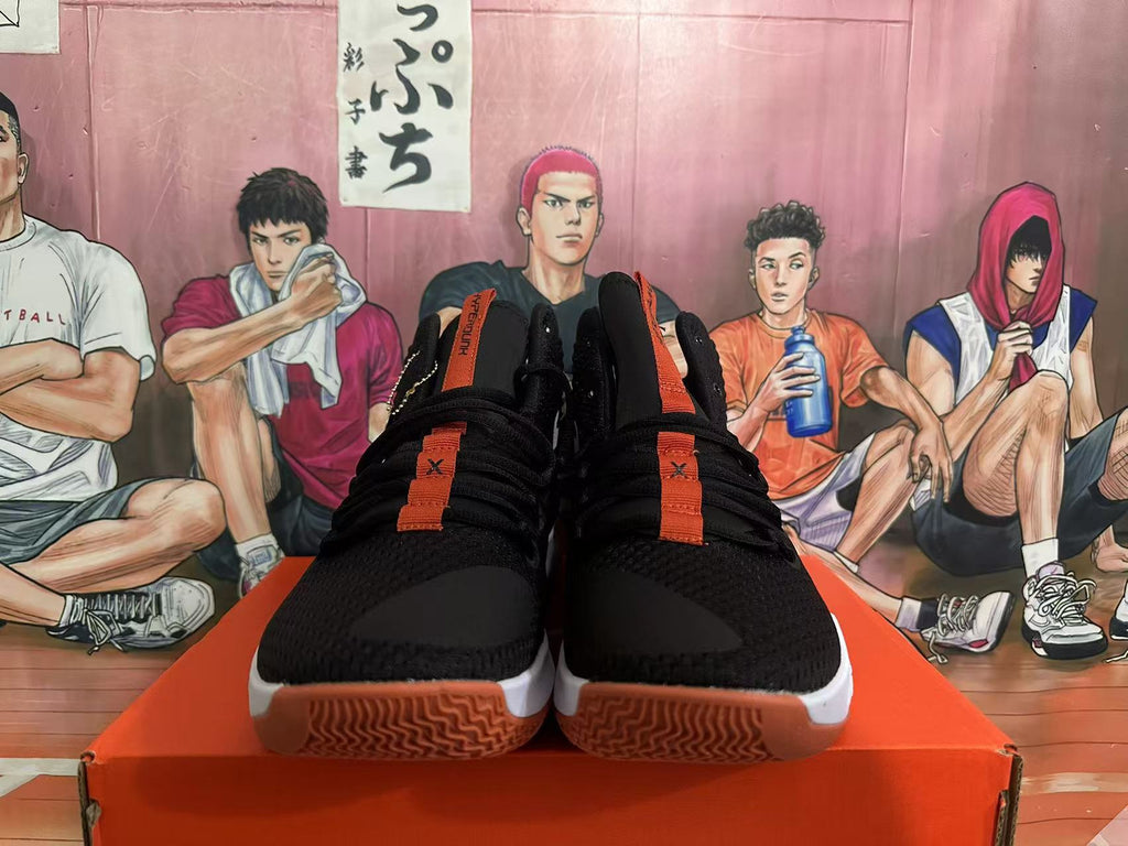 Nike Basketball Sneakers in Black and Orange - product image from the listing.