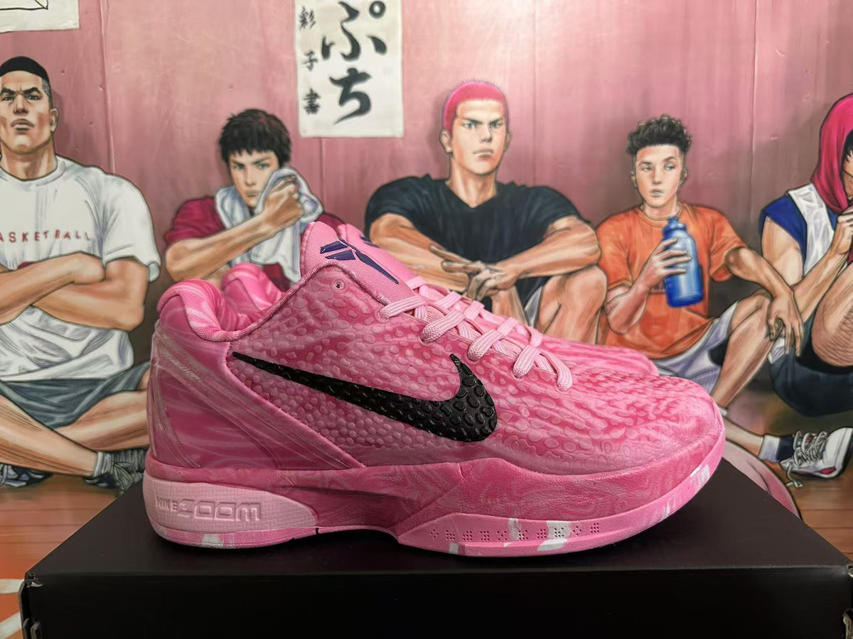 Nike Pink Basketball Trainers with Black Swoosh - product image from the listing.