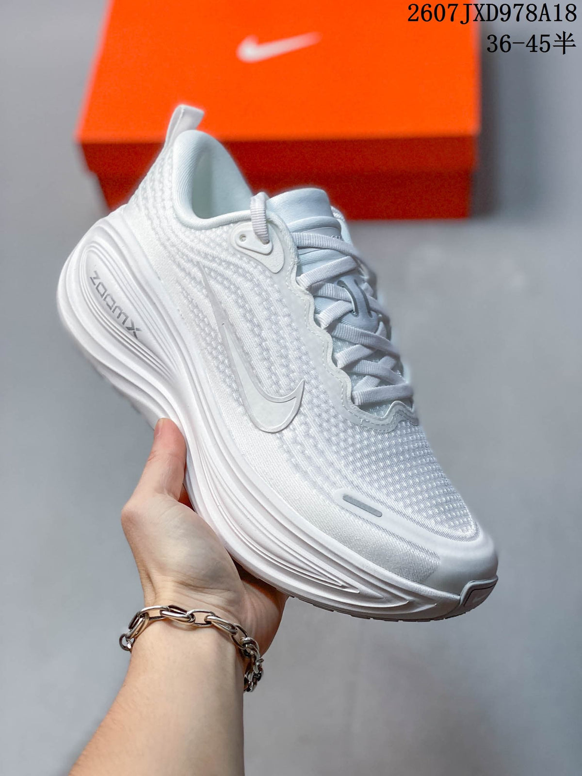 Nike Vomero Plus Running Shoes in White JXD978A18 - product image from the listing.