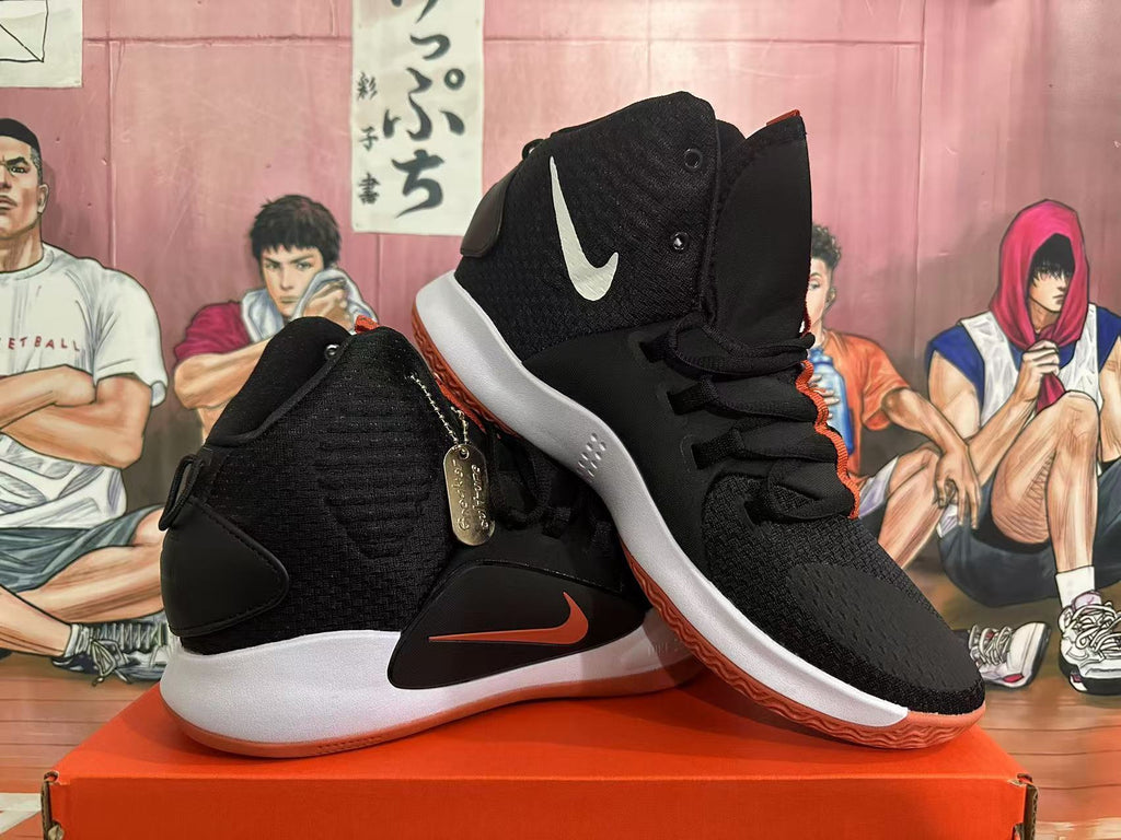 Nike Basketball Sneakers in Black and Orange - product image from the listing.