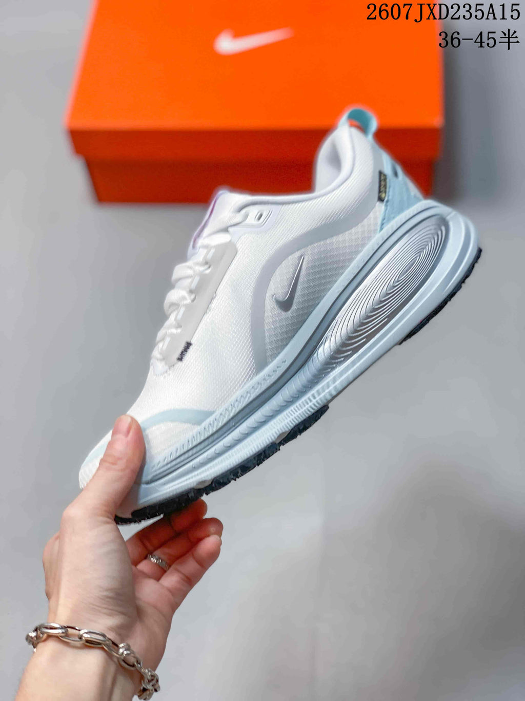 Nike Air Zoom Vomero 18 GTX Running Shoes in White Light Blue - product image from the listing.