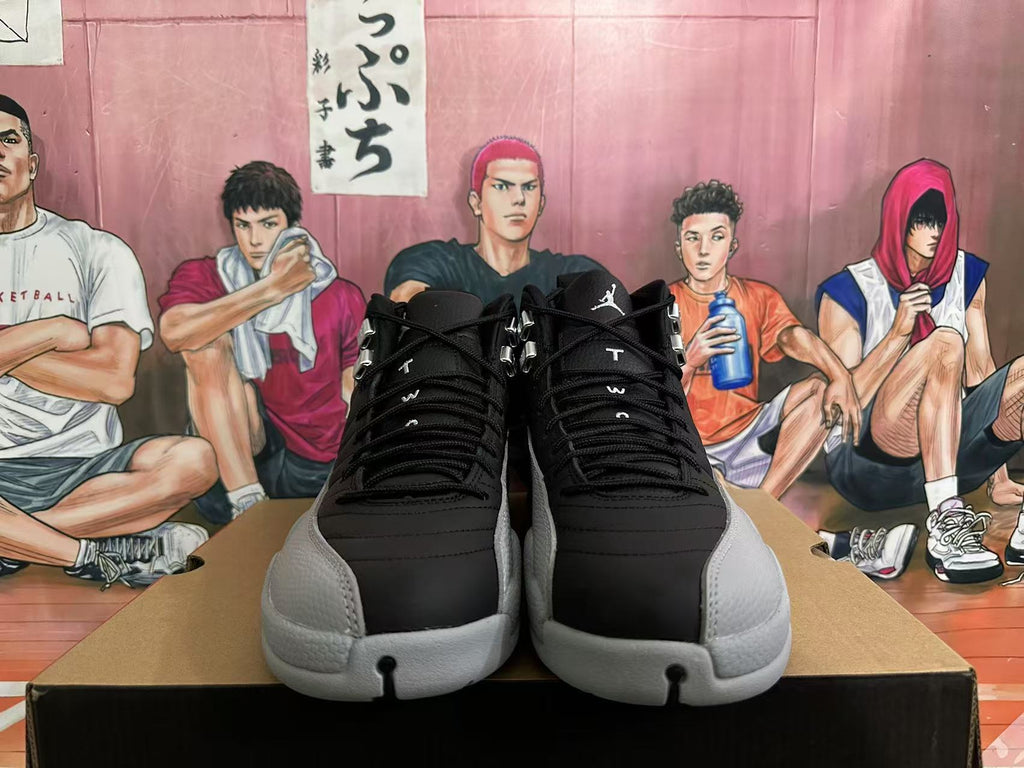 Jordan 12 High-Top Sneakers in Black and Grey - product image from the listing.