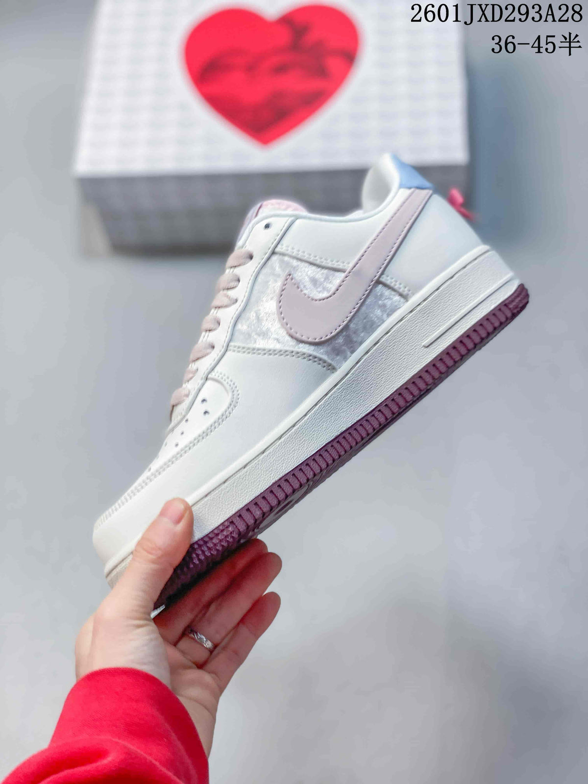 Nike Air Force 1 '07 Low Sneakers in White and Pink 2601JXD293A28 - product image from the listing.