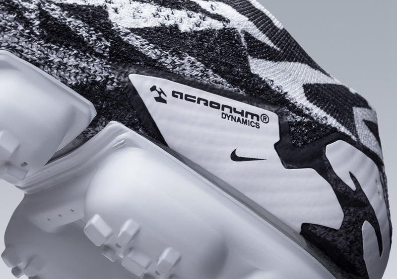 Nike Air VaporMax Moc 2 Acronym in Black White Volt AQ0996-001 - product image from the listing.
