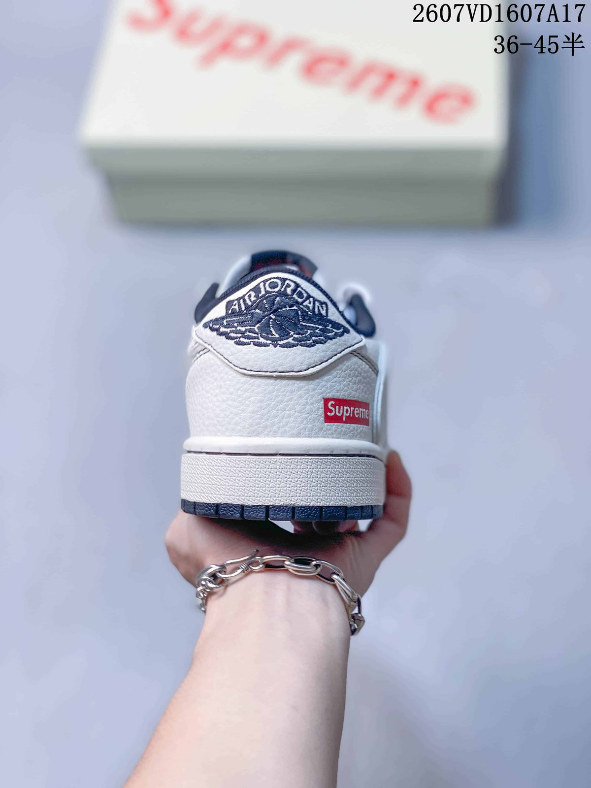 Jordan 1 Low Sneakers in White and Navy - product image from the listing.