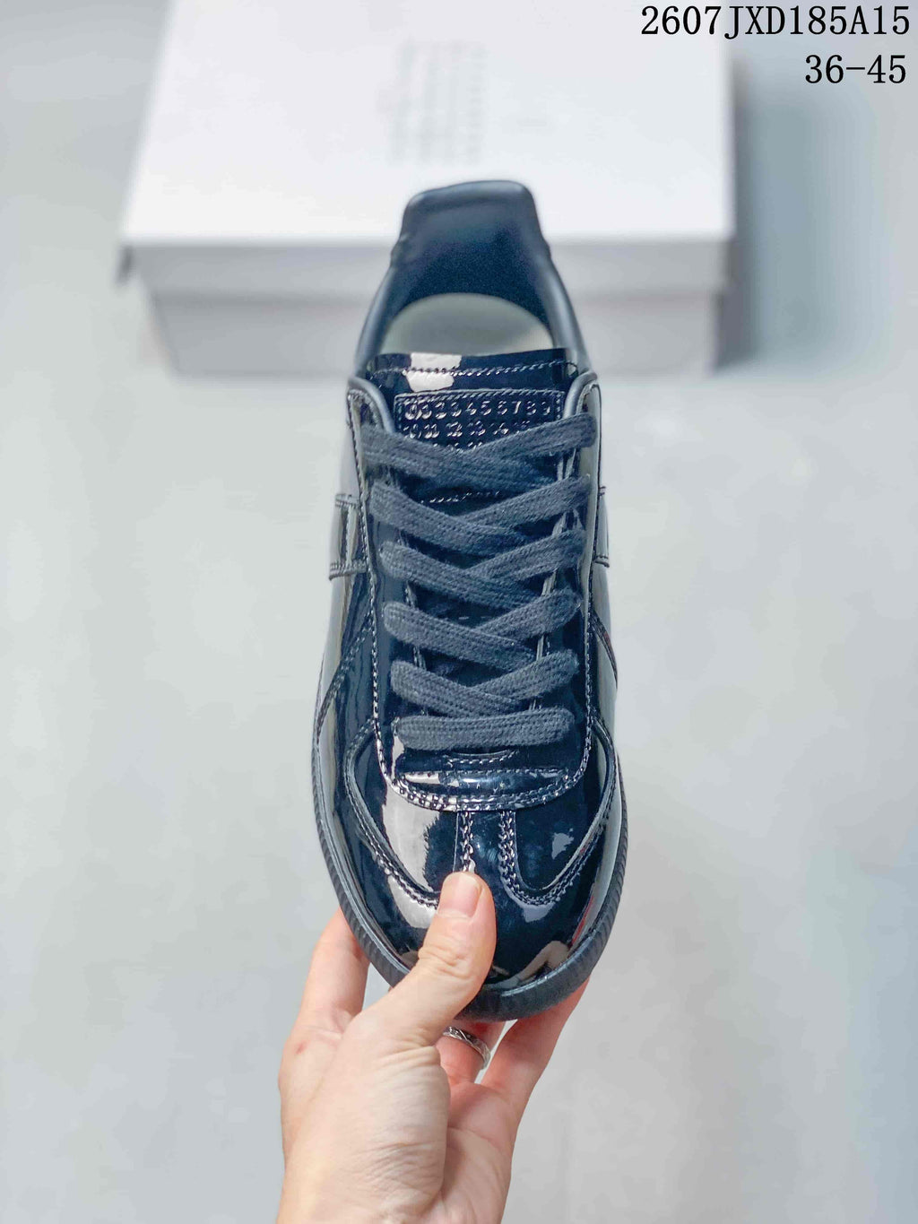 Maison Margiela S57WS0236 Glossy Low-Cut Sneakers - product image from the listing.