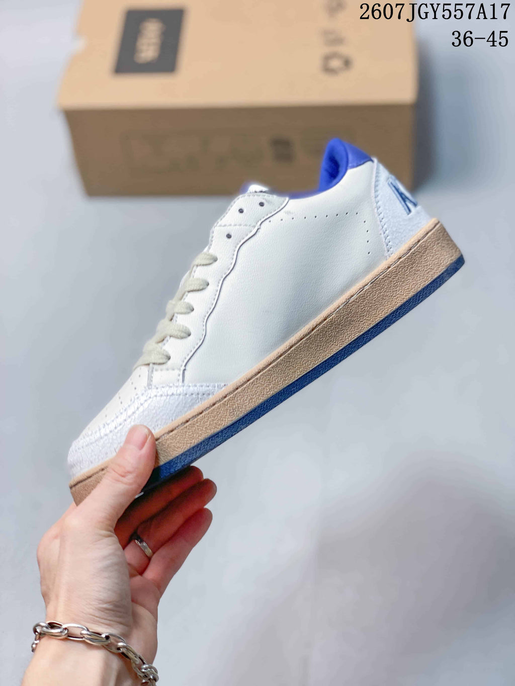 Golden Goose Ball Star Low-Top Sneakers in White and Blue 2607JGY557A17 - product image from the listing.
