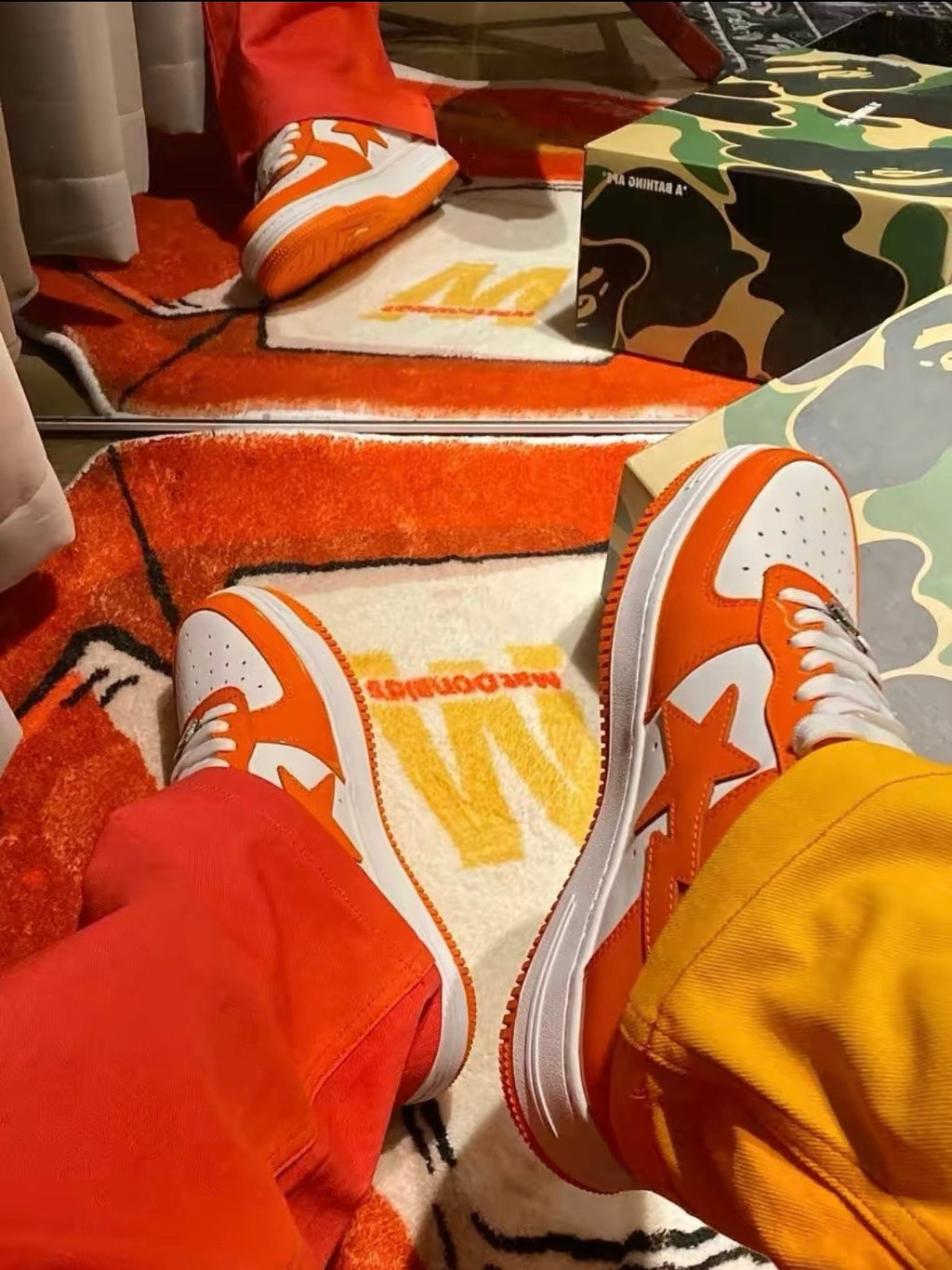 A Bathing Ape BAPE STA Low Sneakers in White Orange - product image from the listing.