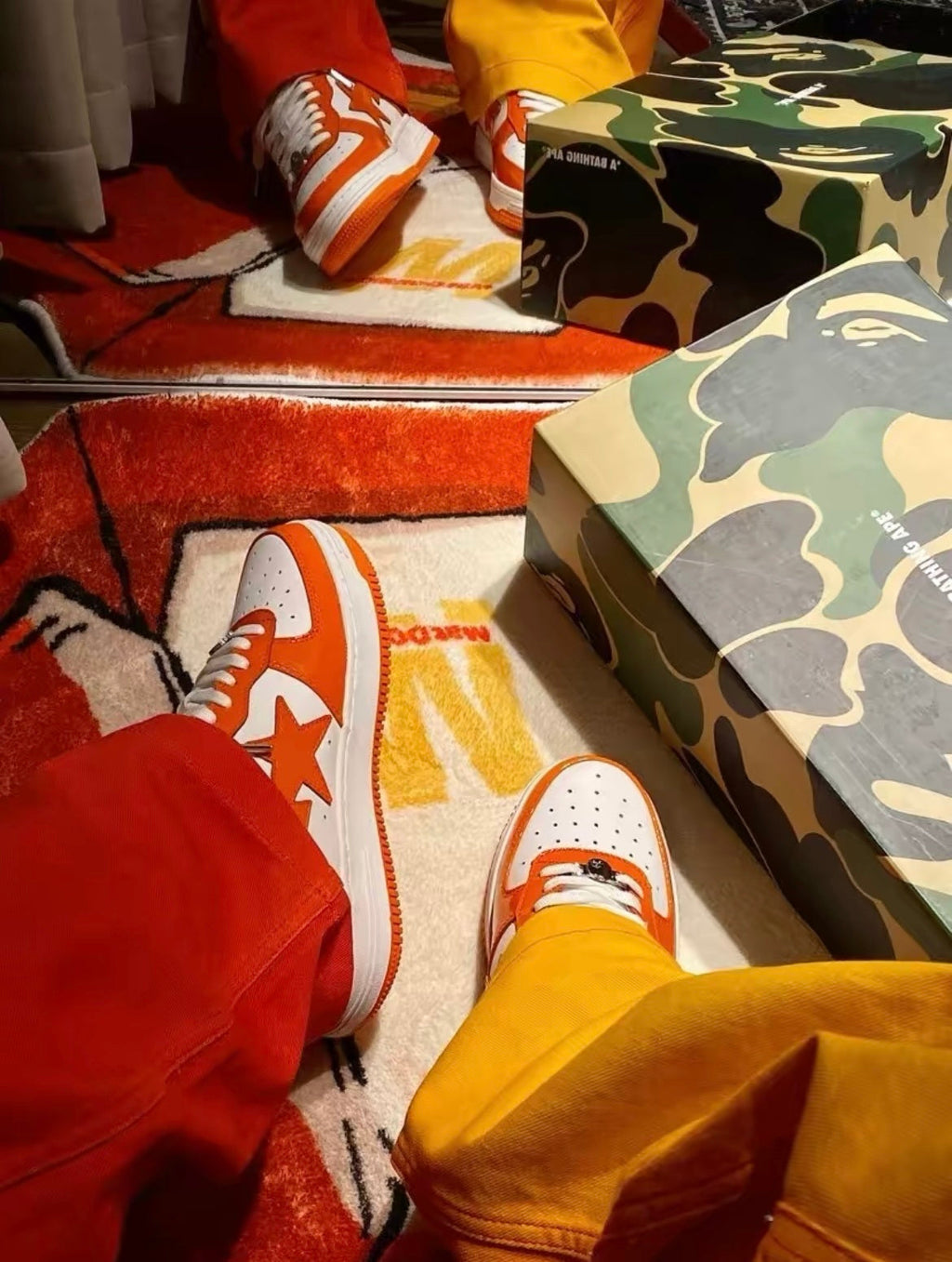 A Bathing Ape BAPE STA Low Sneakers in White Orange - product image from the listing.