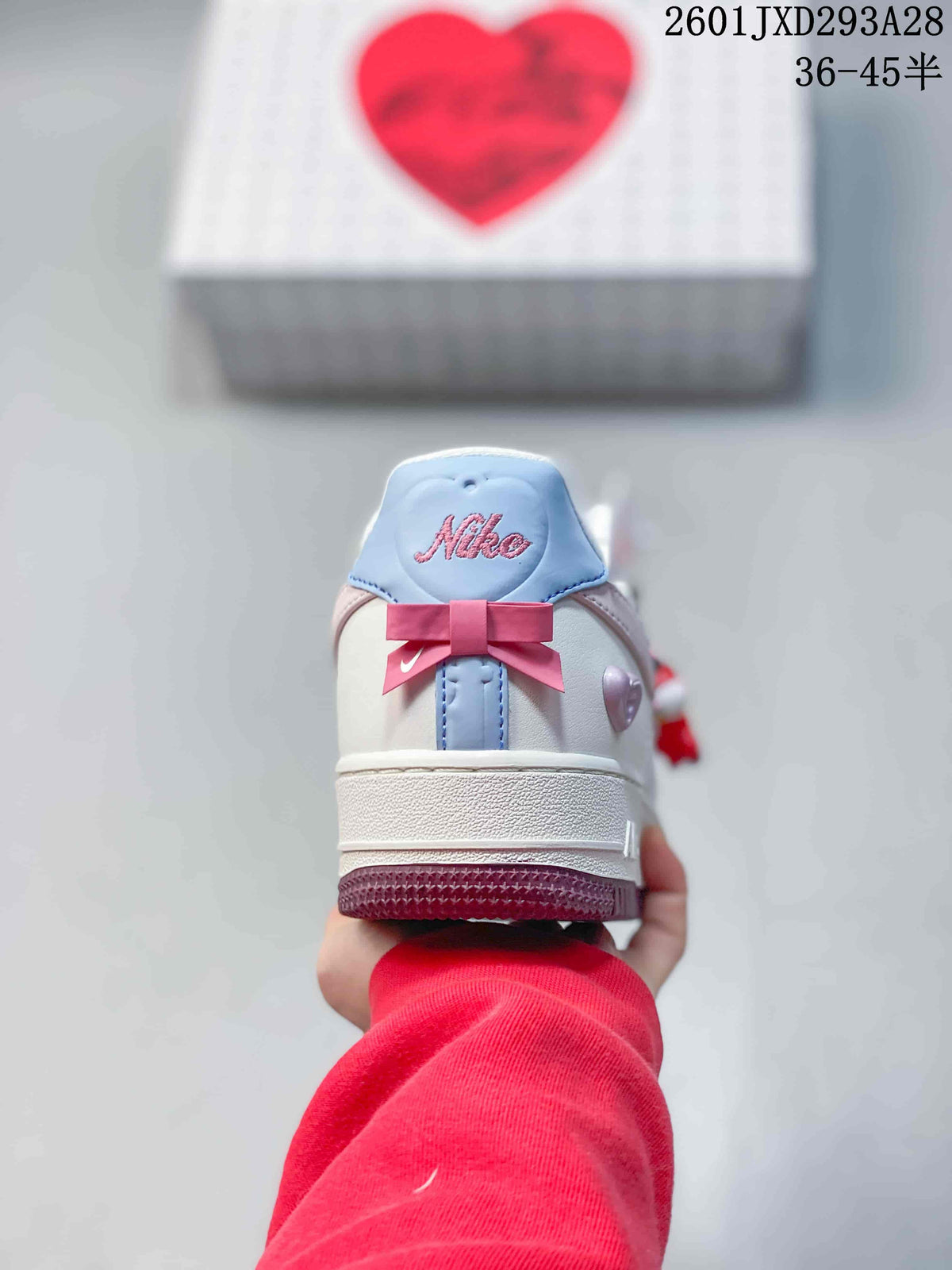 Nike Air Force 1 '07 Low Sneakers in White and Pink 2601JXD293A28 - product image from the listing.