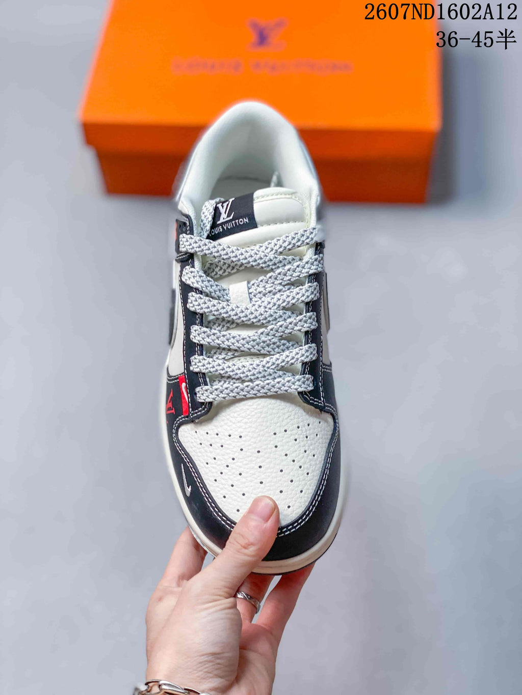 Nike SB Dunk Low Sneakers in Black White Red - product image from the listing.