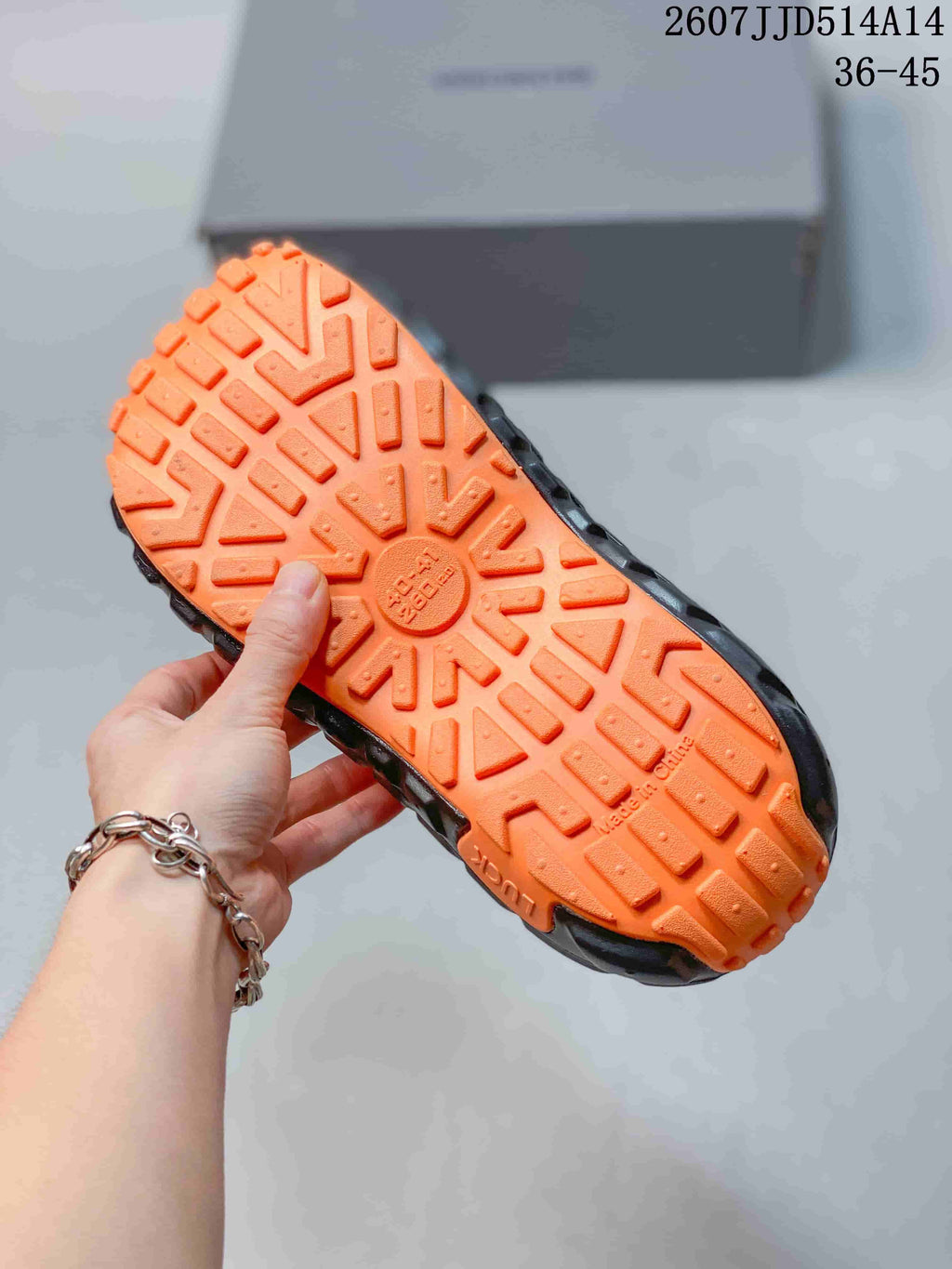 Balenciaga Tire Sole Clog Sandals in Black Orange 2607JJD514A14 - product image from the listing.
