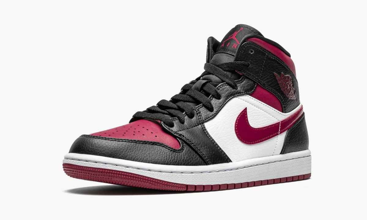 "Bred Toe" Air Jordan 1 Mid Sneakers - product image from the listing.