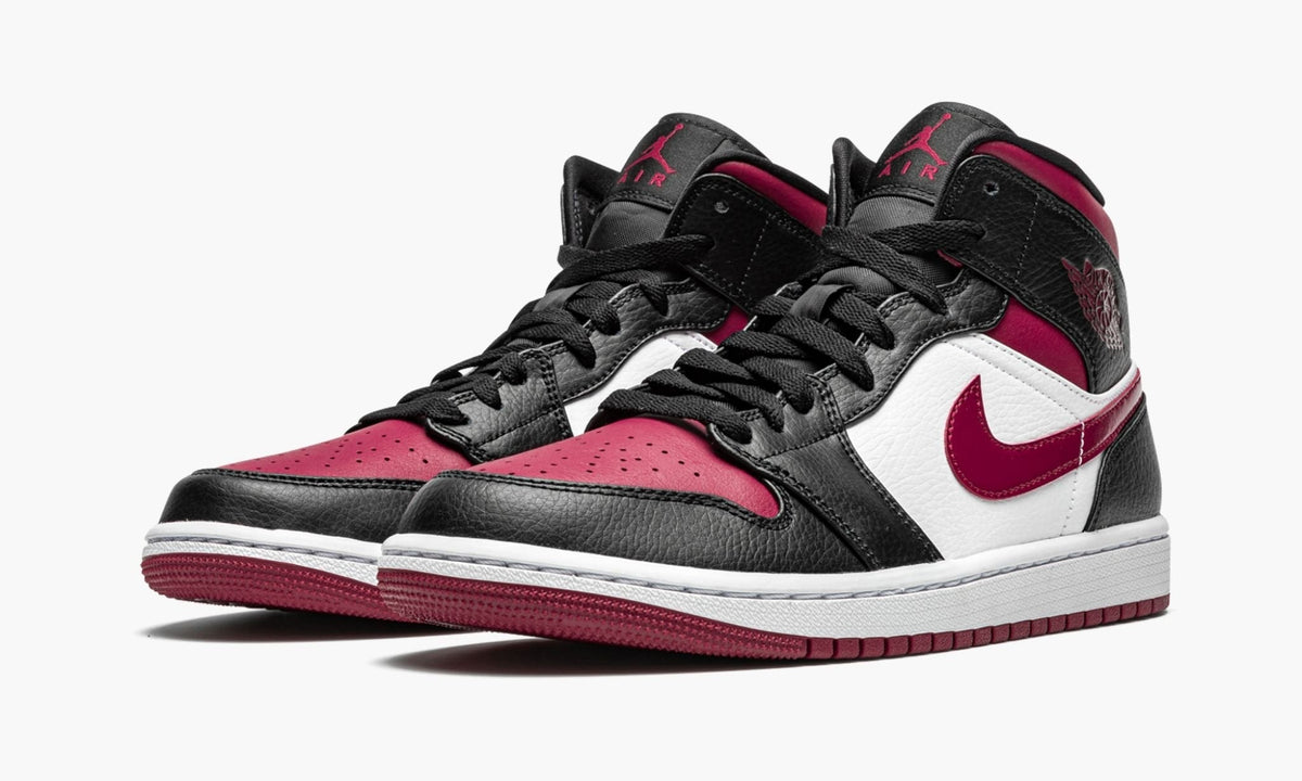 "Bred Toe" Air Jordan 1 Mid Sneakers - product image from the listing.