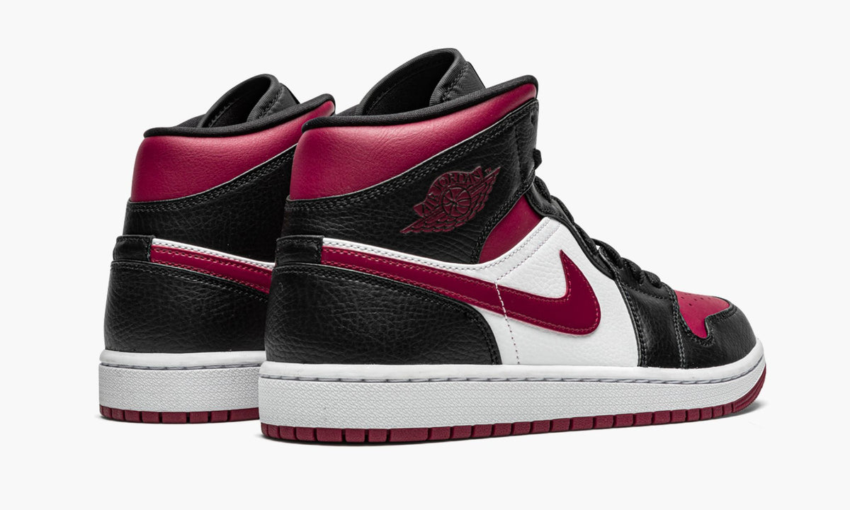 "Bred Toe" Air Jordan 1 Mid Sneakers - product image from the listing.