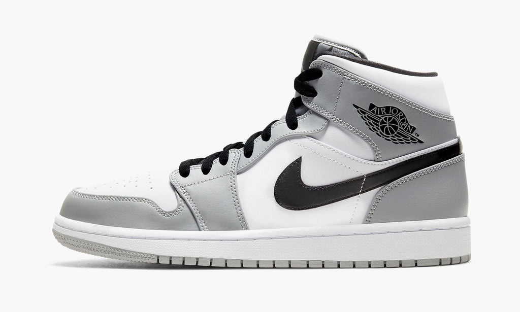 Air Jordan 1 Mid Sneakers in Light Smoke Grey - product image from the listing.