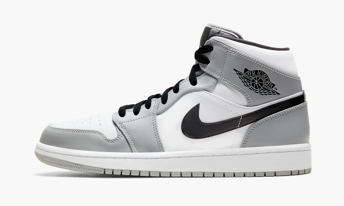 Air Jordan 1 Mid Sneakers in Light Smoke Grey - product image from the listing.