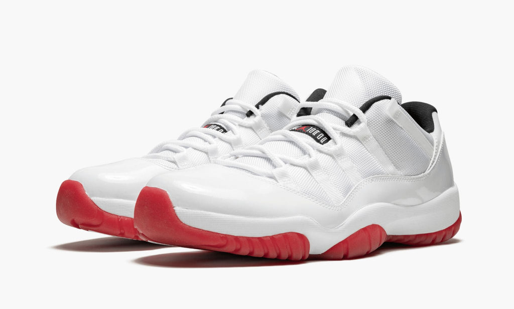 Air Jordan 11 Retro Low White/Varsity Sneakers in Red - product image from the listing.